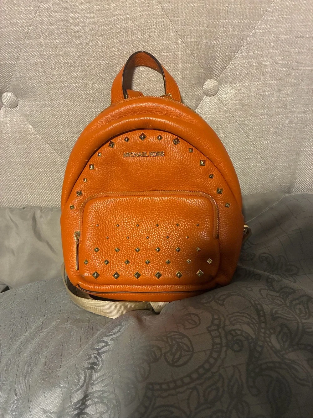 Michael Kors Bright Orange Pebbled Leather Studded Mini Backpack